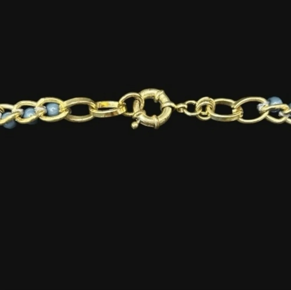 Gold plated cuban link chain with dangling graduated color jasper roundbeads